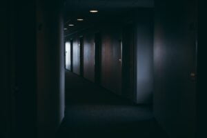 Dark moody look down hotel motel hallway scary dim modern new contemporary