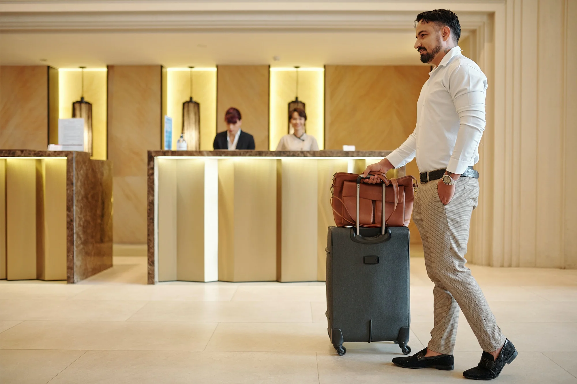 Elegant man entering hotel lobby